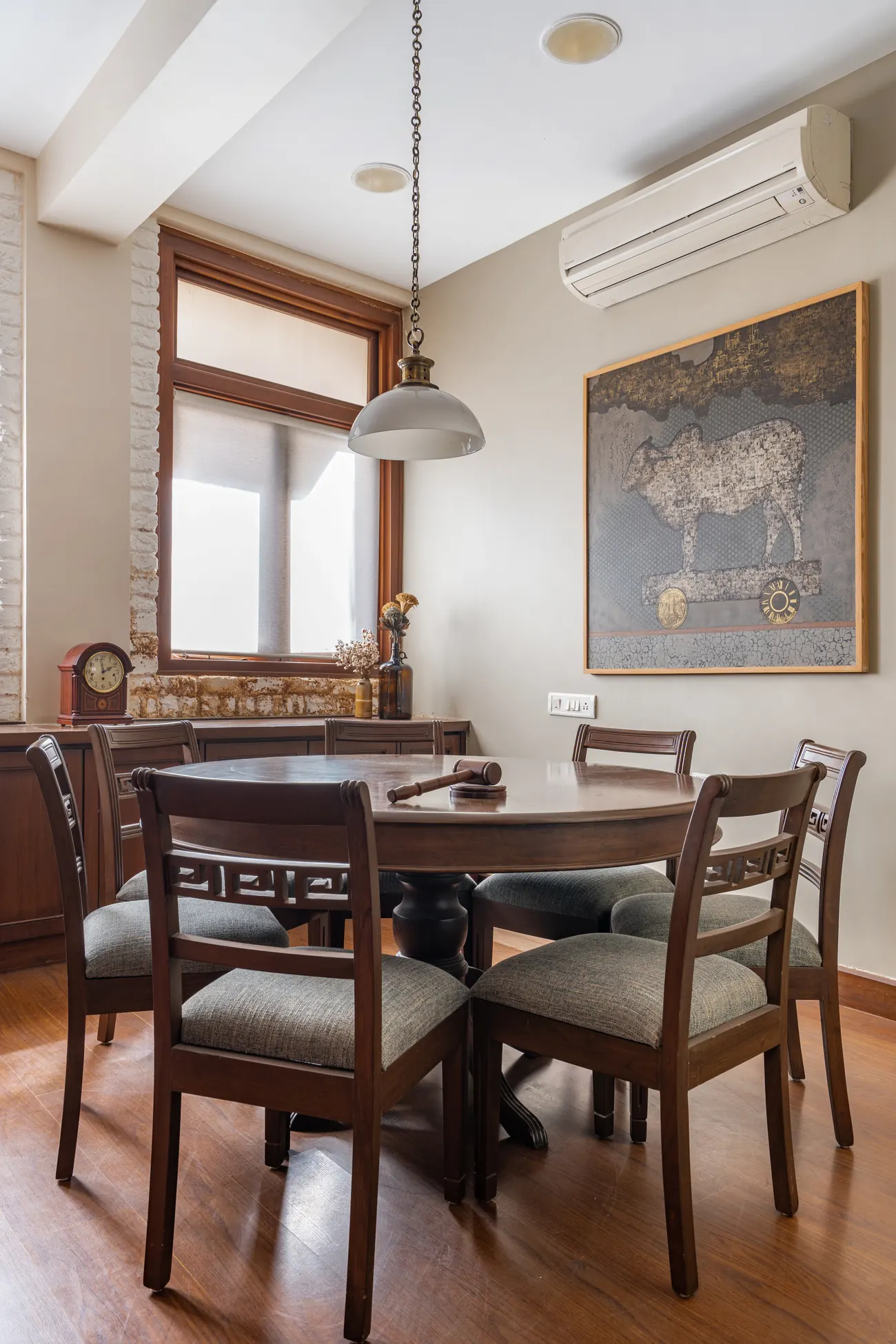 A second library and conference room at Lawyers Chambers with a long wood table, cane-backed chairs and glazed bookcases of law books.